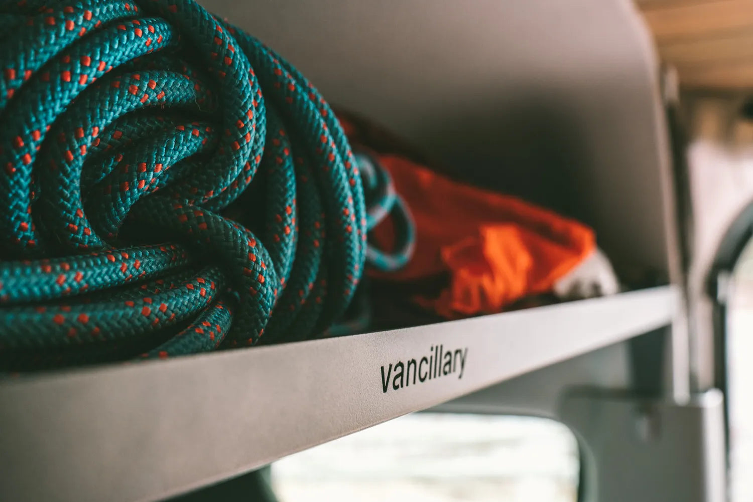 Mercedes Sprinter Headliner Shelf Aluminum holding climbing rope and other lightweight materials above the front cabin, driver and passenger seats.